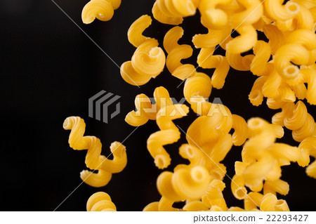 Falling cavatappi pasta. Flying yellow raw Falling cavatappi pasta. Flying yellow raw 22293427