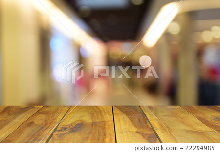 blurred wood table and people in the shopping mall 22294985