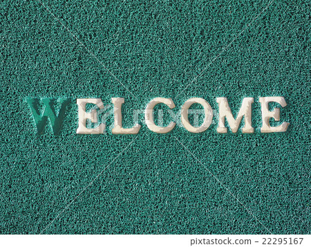 Welcome text on green doormat 22295167