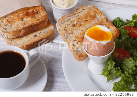 Vitamin breakfast. Boiled egg with toast and salad 22296988