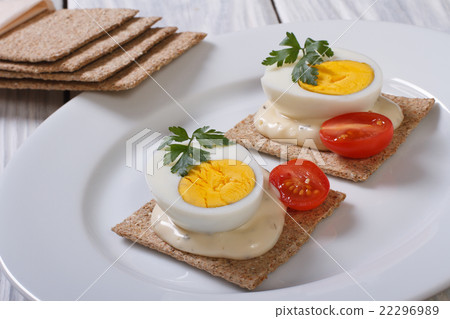 Sandwich with boiled egg and crackers Sandwich with boiled egg and crackers 22296989