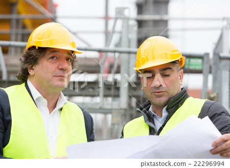 Construction workers with helmet at work 22296994