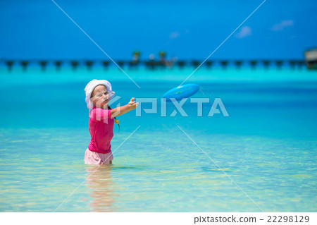 Little girl playing with flying disc at white Little girl playing with flying disc at white 22298129