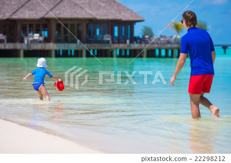 Happy family having fun on white tropical beach Happy family having fun on white tropical beach 22298212