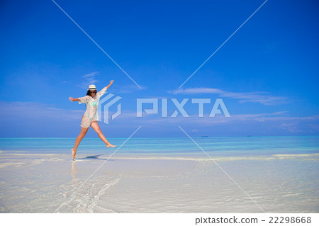 Young woman enjoy tropical beach vacation 22298668