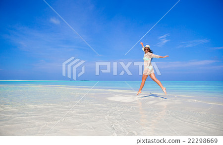 Young girl having fun on tropical white  beach  22298669