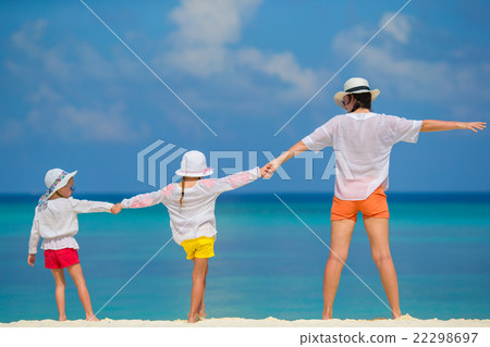 Little girls and mother on tropical white beach  22298697