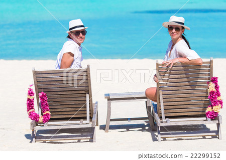 Young happy couple on white beach at summer Young happy couple on white beach at summer 22299152