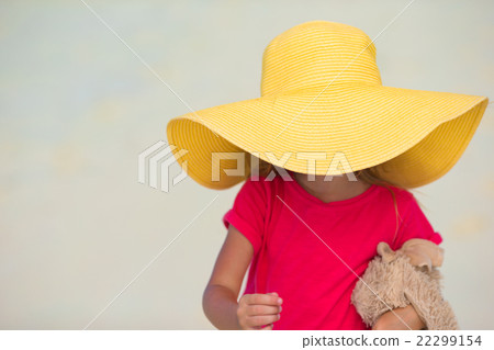 Adorable little girl in hat at beach during summer 22299154