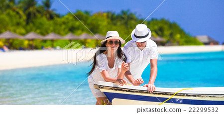 Young couple on white beach at summer vacation Young couple on white beach at summer vacation 22299532
