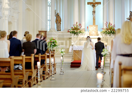 Bride and groom at the church during a wedding Bride and groom at the church during a wedding 22299755