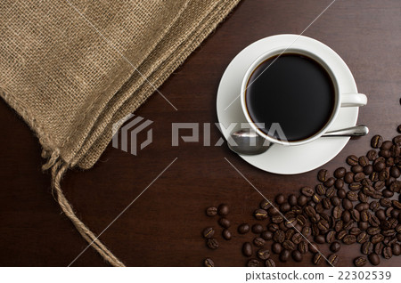 A cup of coffee and a hemp bag and a coffee bean sandwiched between it and a copy space Spacious full bird's eye view 22302539