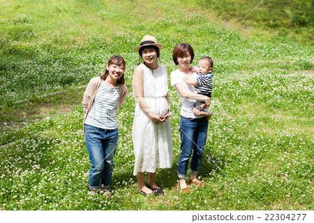 Babies and mums playing in the park Babies and mums playing in the park 22304277