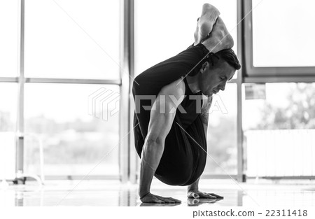 Athletic muscular young man working out, yoga Athletic muscular young man working out, yoga 22311418