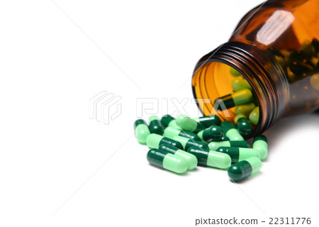 group of green capsule medicine in bottle group of green capsule medicine in bottle 22311776