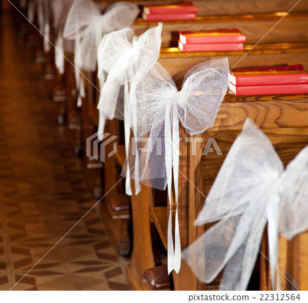 White bows in Catholic Church. 22312564