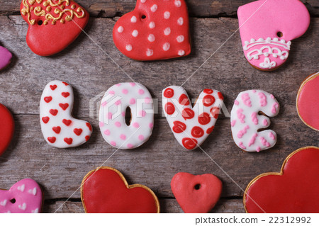 Love and heart. Beautiful cakes on a wooden table Love and heart. Beautiful cakes on a wooden table 22312992