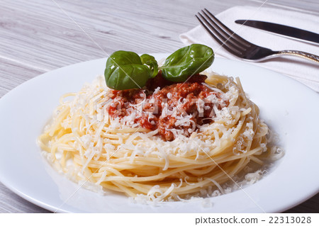Spaghetti with bolognese sauce and parmesan cheese Spaghetti with bolognese sauce and parmesan cheese 22313028