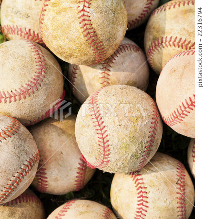 closeup of pile up a stack of old baseball in green 22316794
