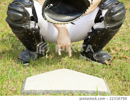 baseball catcher showing gesture for secret sign 22316798