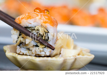Sushi salmon roll with chopstick Sushi salmon roll with chopstick 22317920