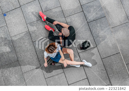 Top view man and woman sitting on a longboard Top view man and woman sitting on a longboard 22321842