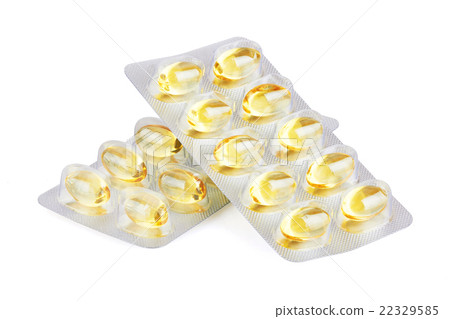 Yellow pills  on white 22329585