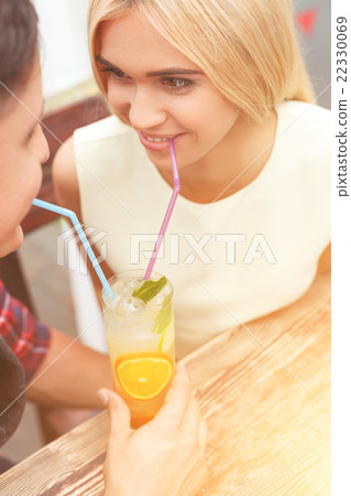 Cute loving couple is relaxing in cafe 22330069