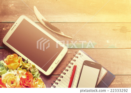 Tablets on the old wooden Tablets on the old wooden 22333292