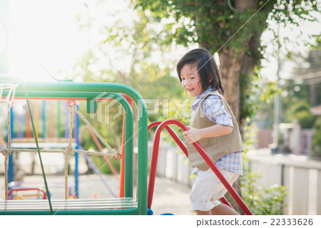 child playing on playground in summer outdoor park 22333626