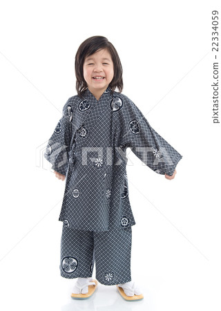 Happy asian boy in kimono standing on background 22334059