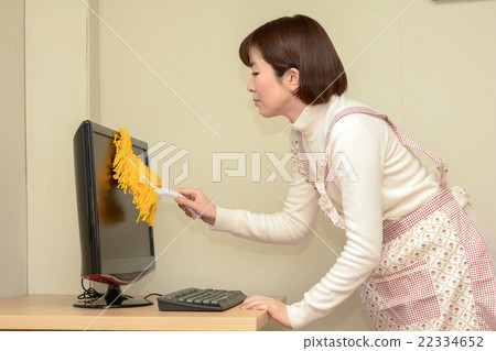 A woman taking monitor dust 22334652