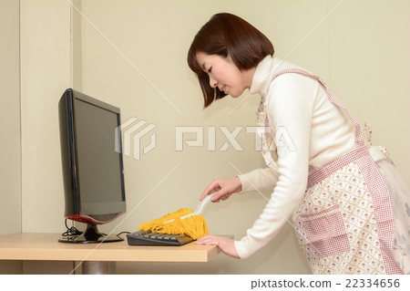 A woman taking monitor dust A woman taking monitor dust 22334656