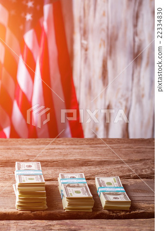 American flag and dollar bundles. 22334830