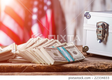 Dollars, case and USA flag. 22334833