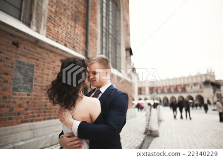 Gorgeous wedding couple, bride, groom posing near 22340229