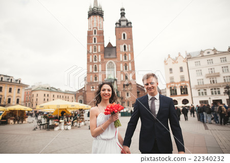 Elegant beautiful wedding couple walking on the 22340232