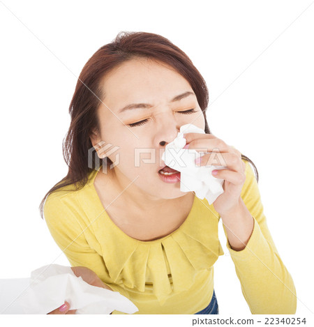 woman with a an allergy sneezing into tissues woman with a an allergy sneezing into tissues 22340254