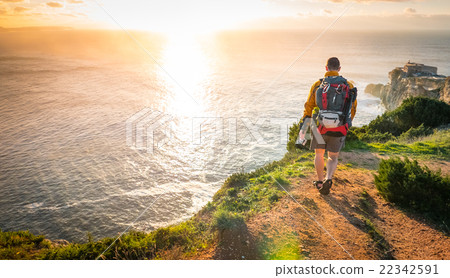 Young Explorer Walking Towards Sunset 22342591