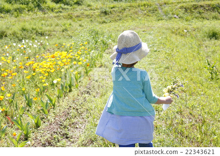 A girl with flowers 22343621