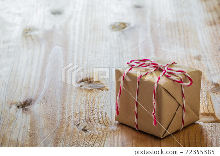 Gift box on wood board 22355385