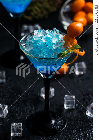 Blue cocktail in martini glasses 22356383