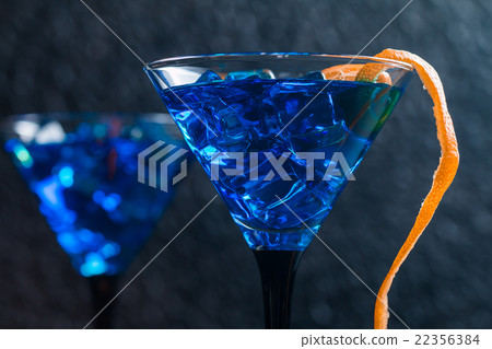 Blue cocktail in martini glasses 22356384