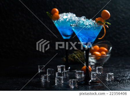 Blue cocktail in martini glasses Blue cocktail in martini glasses 22356406