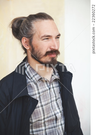 Young bearded long haired Asian man 22360272