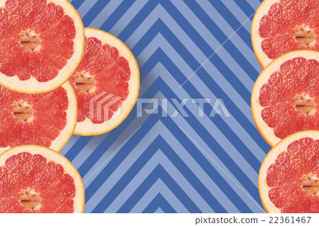 Bright red grapefruit on diagonal lines texture Bright red grapefruit on diagonal lines texture 22361467