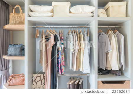 white wardobe and dressing table with clothes  22362684