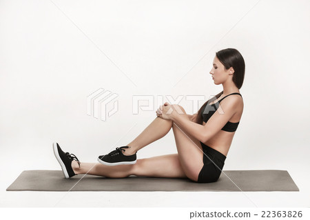 Woman exercising on mat 22363826