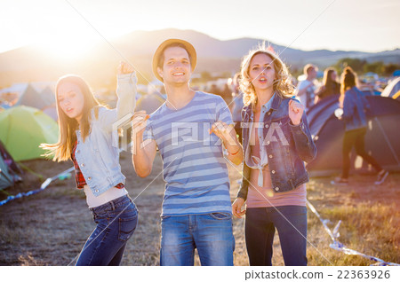 Group of teenagers at summer music festival, sunny 22363926