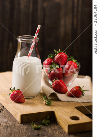 Dark still life with milk and strawberry on rough Dark still life with milk and strawberry on rough 22364194